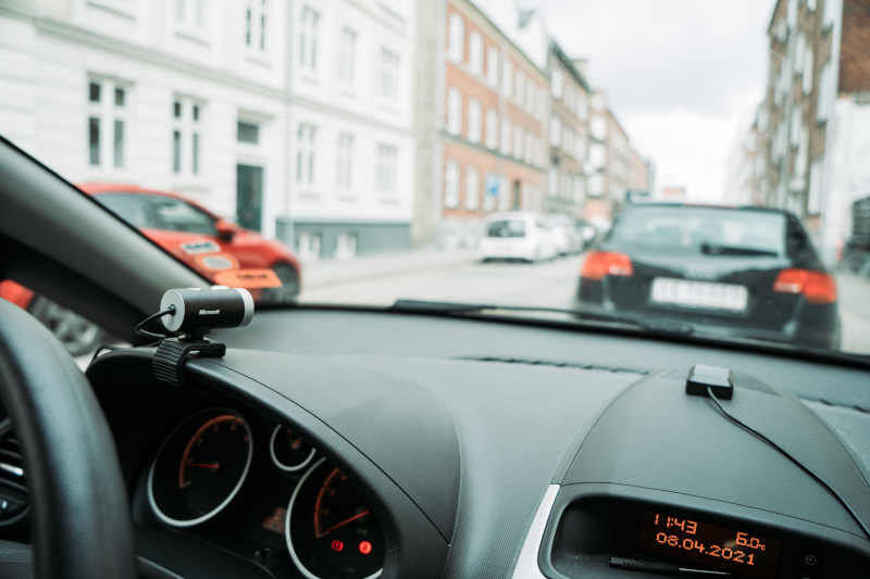 Urban Drive Monitoring with Raspberry Pi Dashcam Raspberry Pi dashcam mounted on dashboard recording urban driving scene